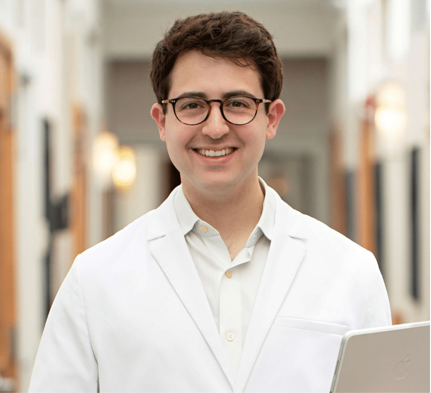 Dr Daniel Standing in Schlessinger MD hallway