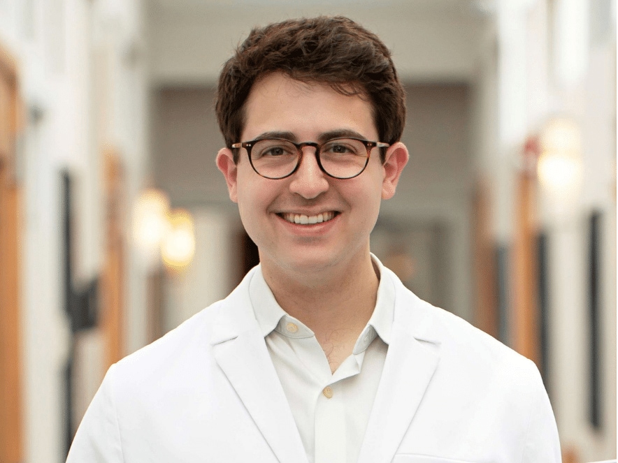 Dr Daniel Standing in Schlessinger MD hallway